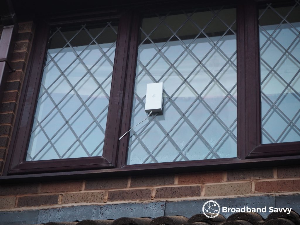 Three 5G Hub antenna mounted on a window.