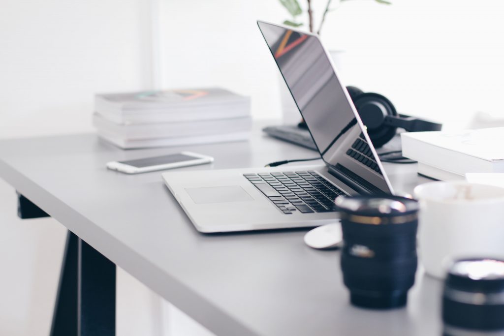 Home office desk with a laptop.