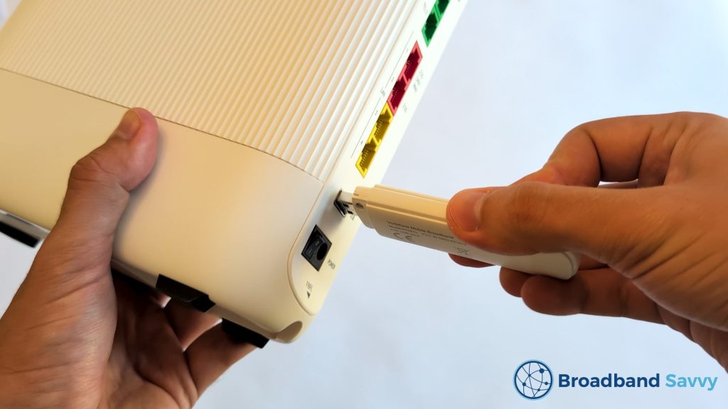 Inserting broadband backup dongle into the Ultra Hub 7. 