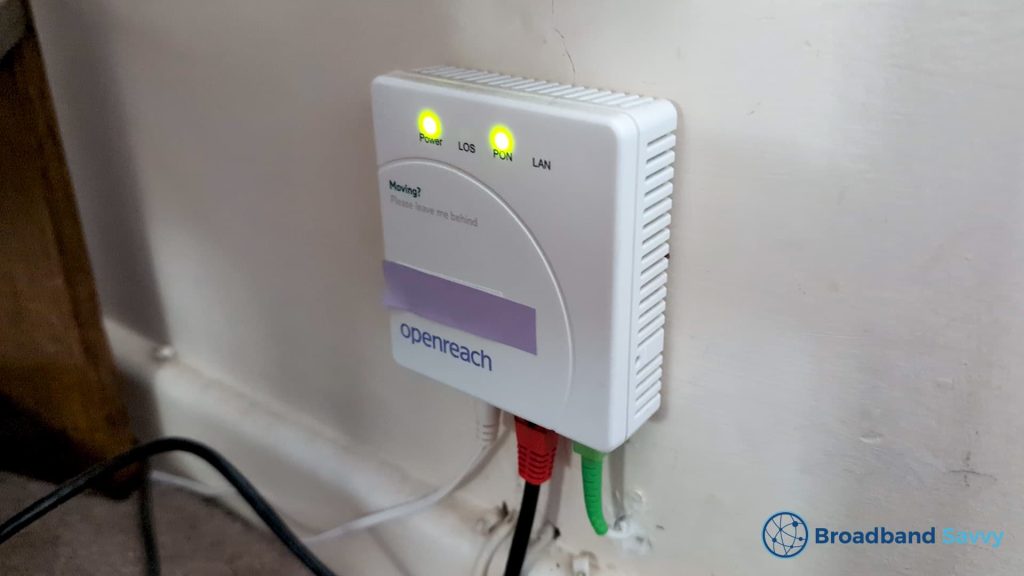 Openreach ONT box with black Ethernet cable plugged into it.