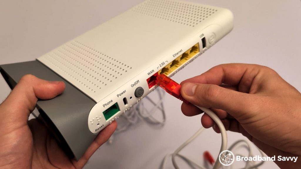 Plugging in the LAN cable in the router.