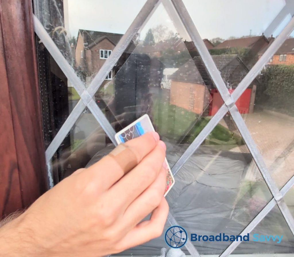 Pressing air bubbles between the electrostatic pad and the window.