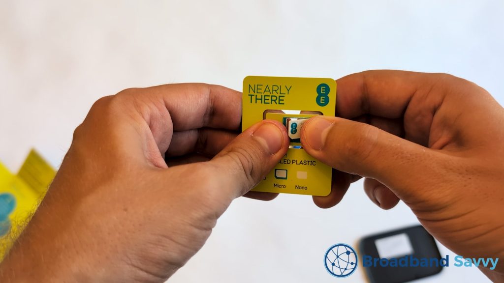 Punching out the SIM card.