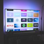 Best Broadband, TV and Landline Phone Deals | UK A smart TV with a number of TV apps displayed on the screen.