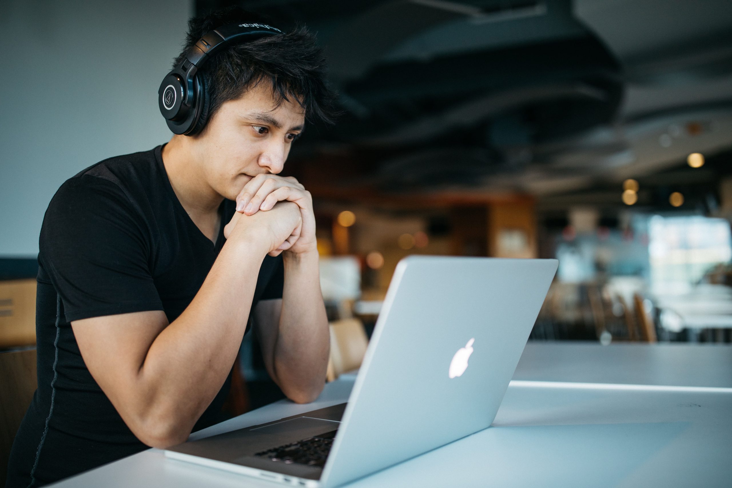 Student studying on a Macbook.